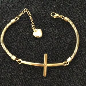 Gold stainless steel cross pendant bracelet w/ extender chain attached.